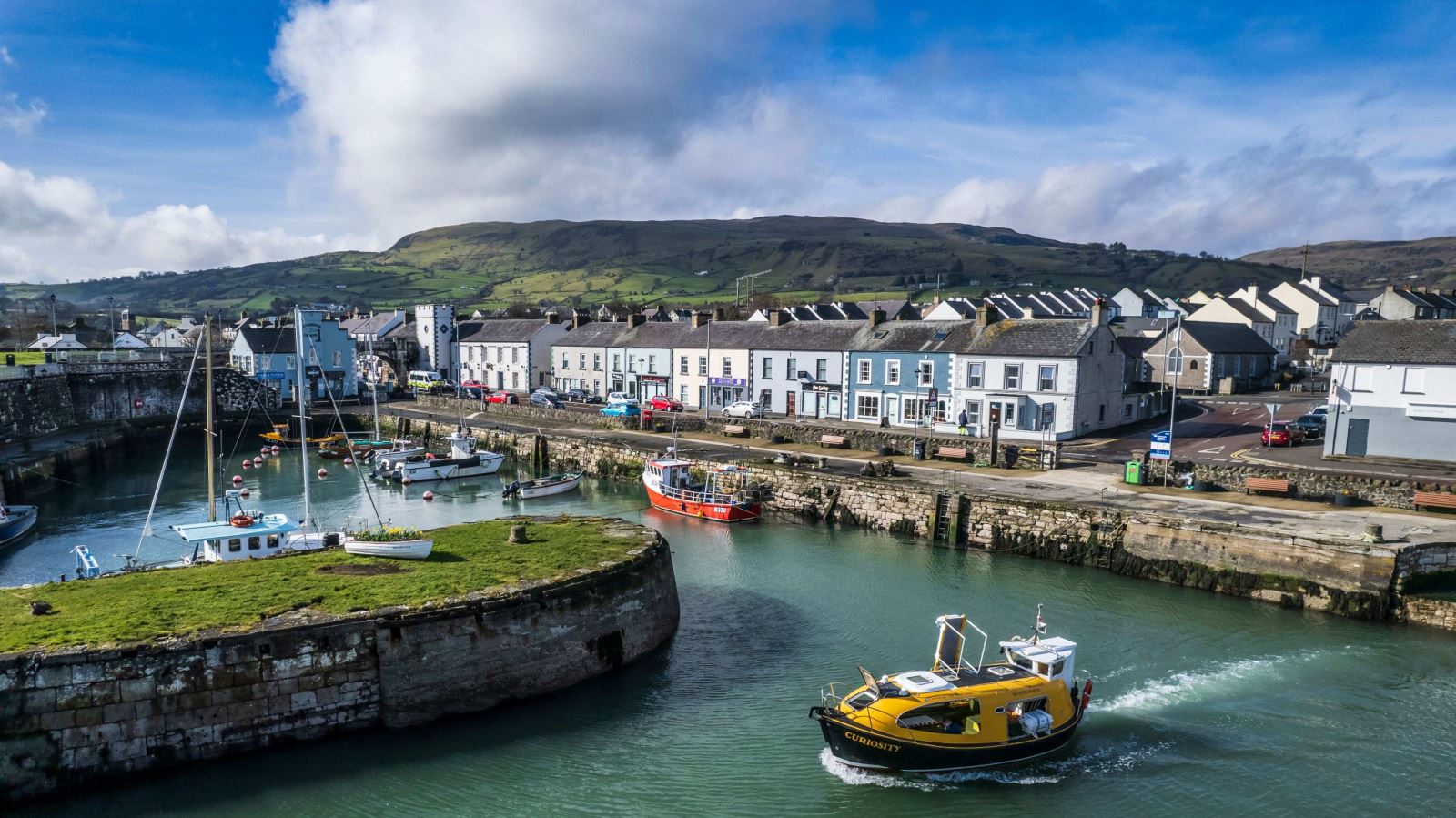 Boat leaving Carnlough Harbour